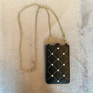 Black Kate Spade mini crossbody with gold chain and pearl details